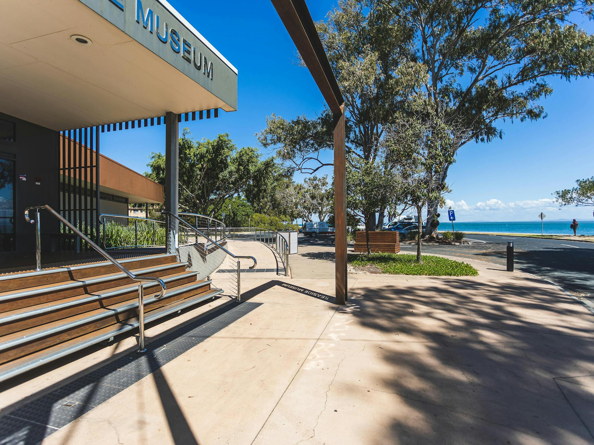 Front entrance of museum with view of water