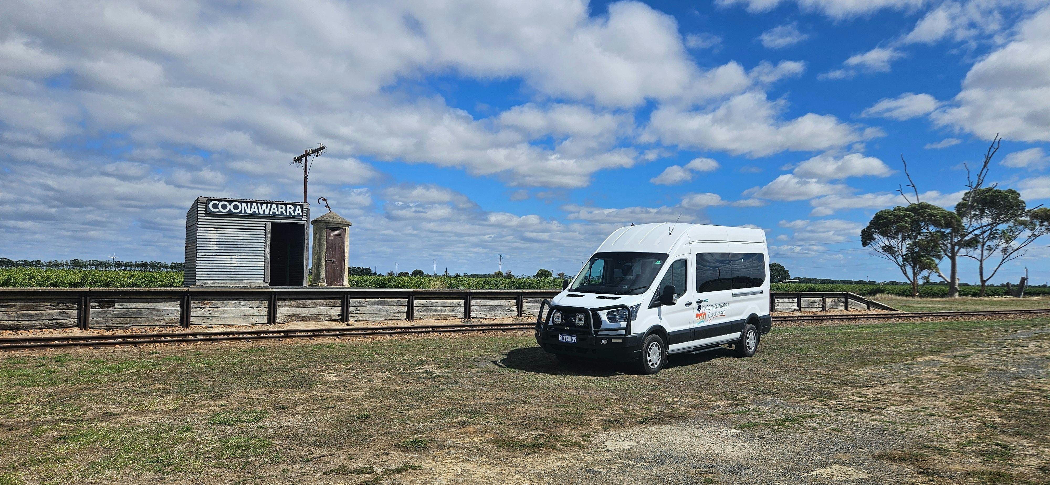 Ford Transit private wine tour vehicle parked at the Coonawarra Railway Siding landmark