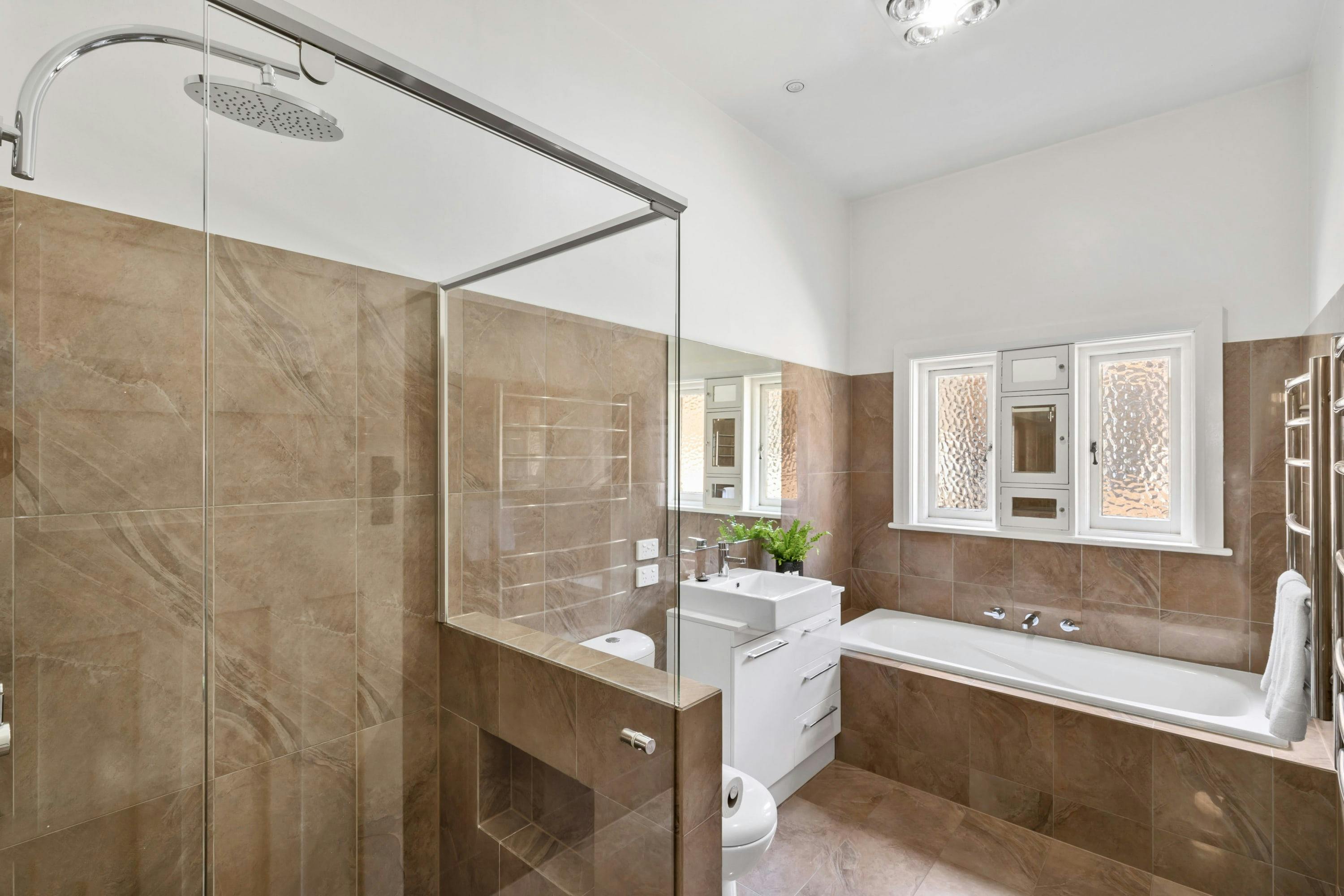 Bathroom with bath, shower and vanity