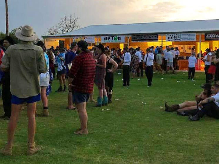 Lots of people outside the bar and food area