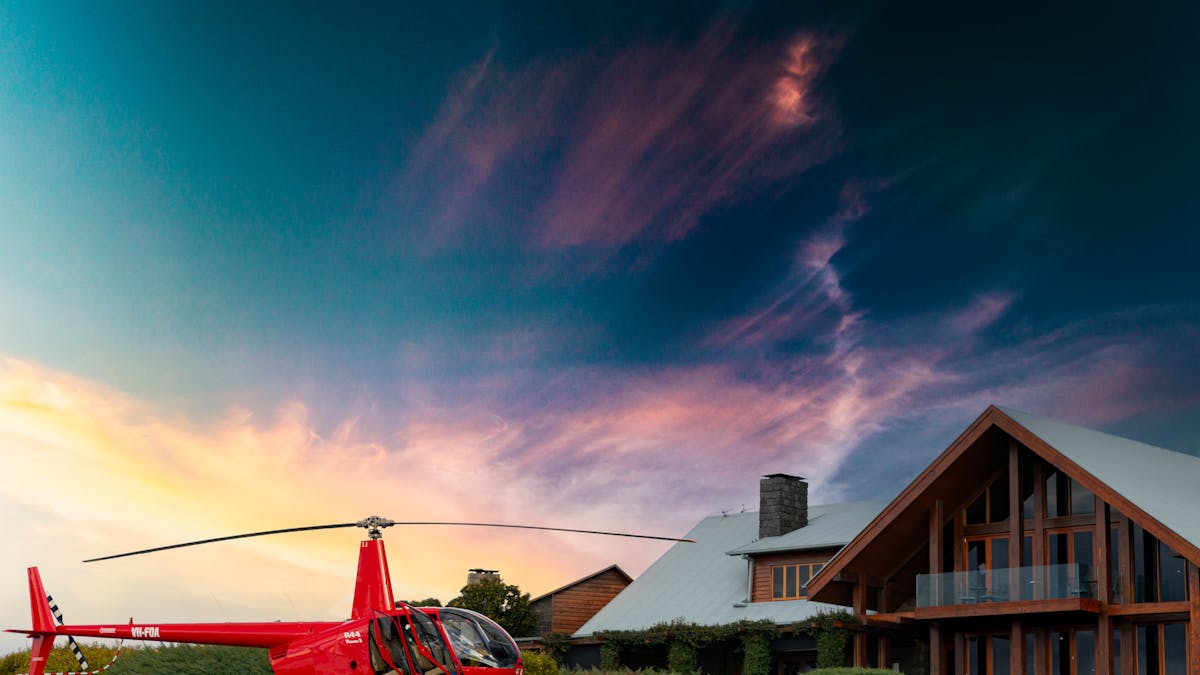 Robinson 44 parked in front of Spicers Peak Lodge.
