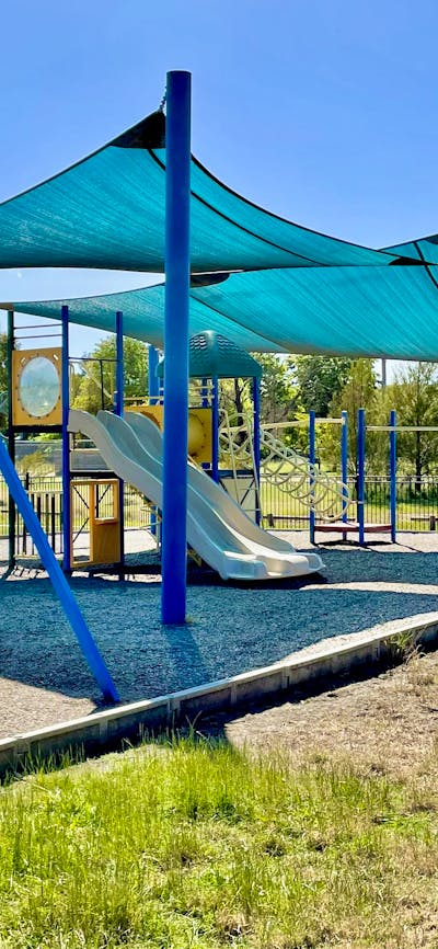 Playground with slide, swings and climbing equipment