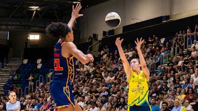 UC Capitals player shooting the basketball while a defender closes in.