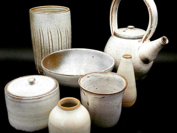 Set of handmade ceramic tableware items finished in an off white satin glaze.