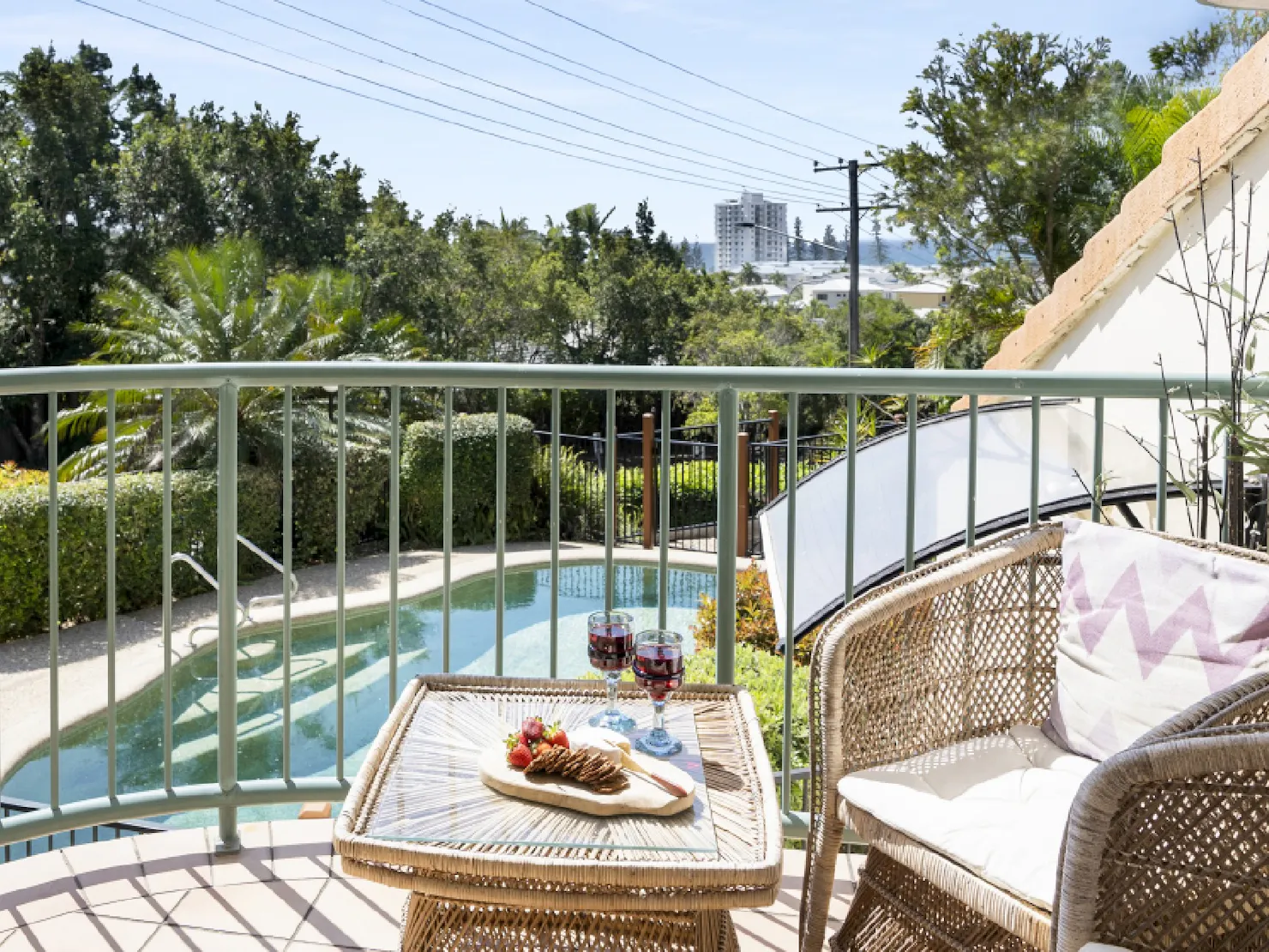 Front balcony overlooking shared pool and views to the ocean