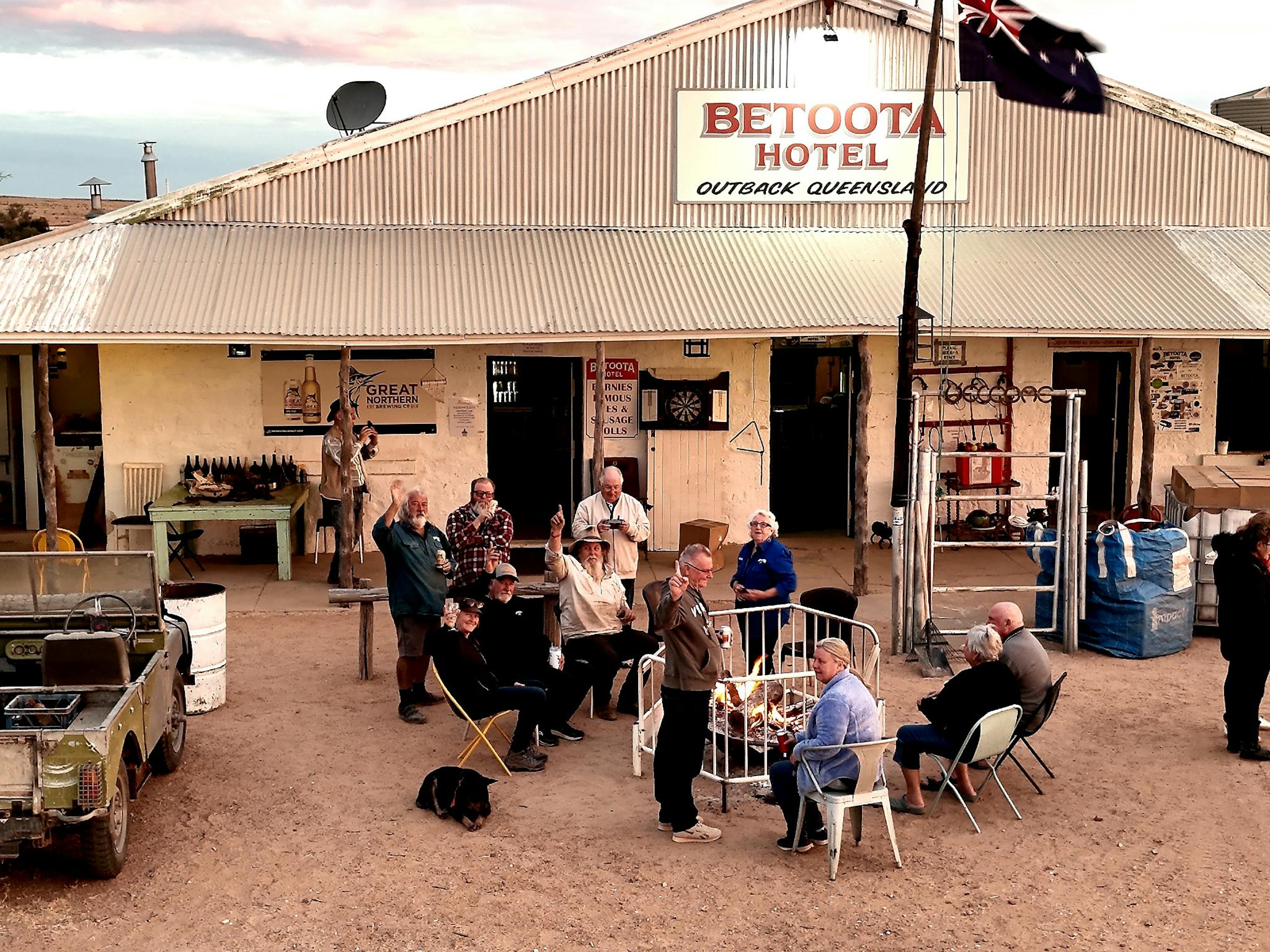 Travellers sharing stories around a fire at the Betoota Hotel in Outback Queensland. Travellers sharing stories around a fire at the Betoota Hotel in Outback Queensland.