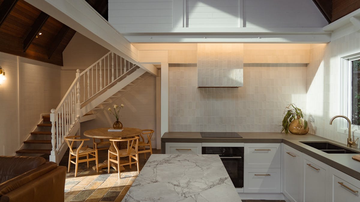Modern kitchen with high end appliances and dining space Modern kitchen with high end appliances and dining space