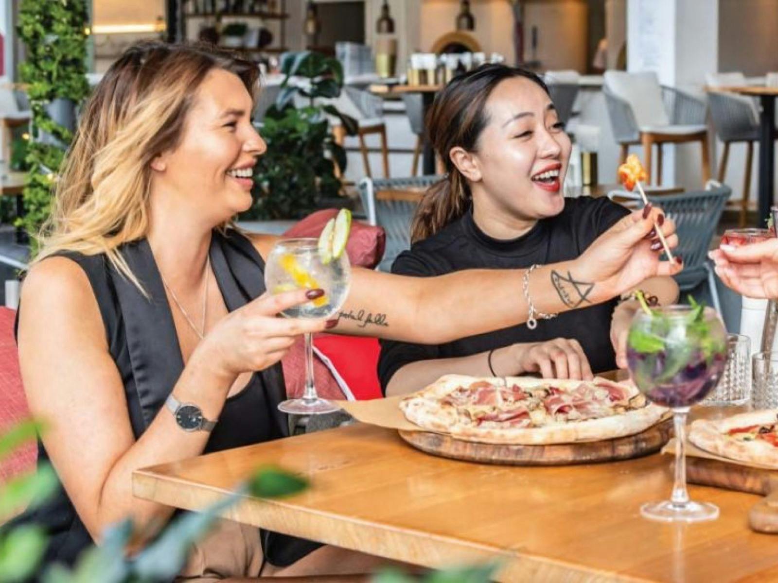 Enjoying Happy Hour At Planar Restaurant