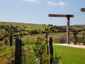 The lush green outdoor area at Varney Wines and view of Onkaparinga Gorge