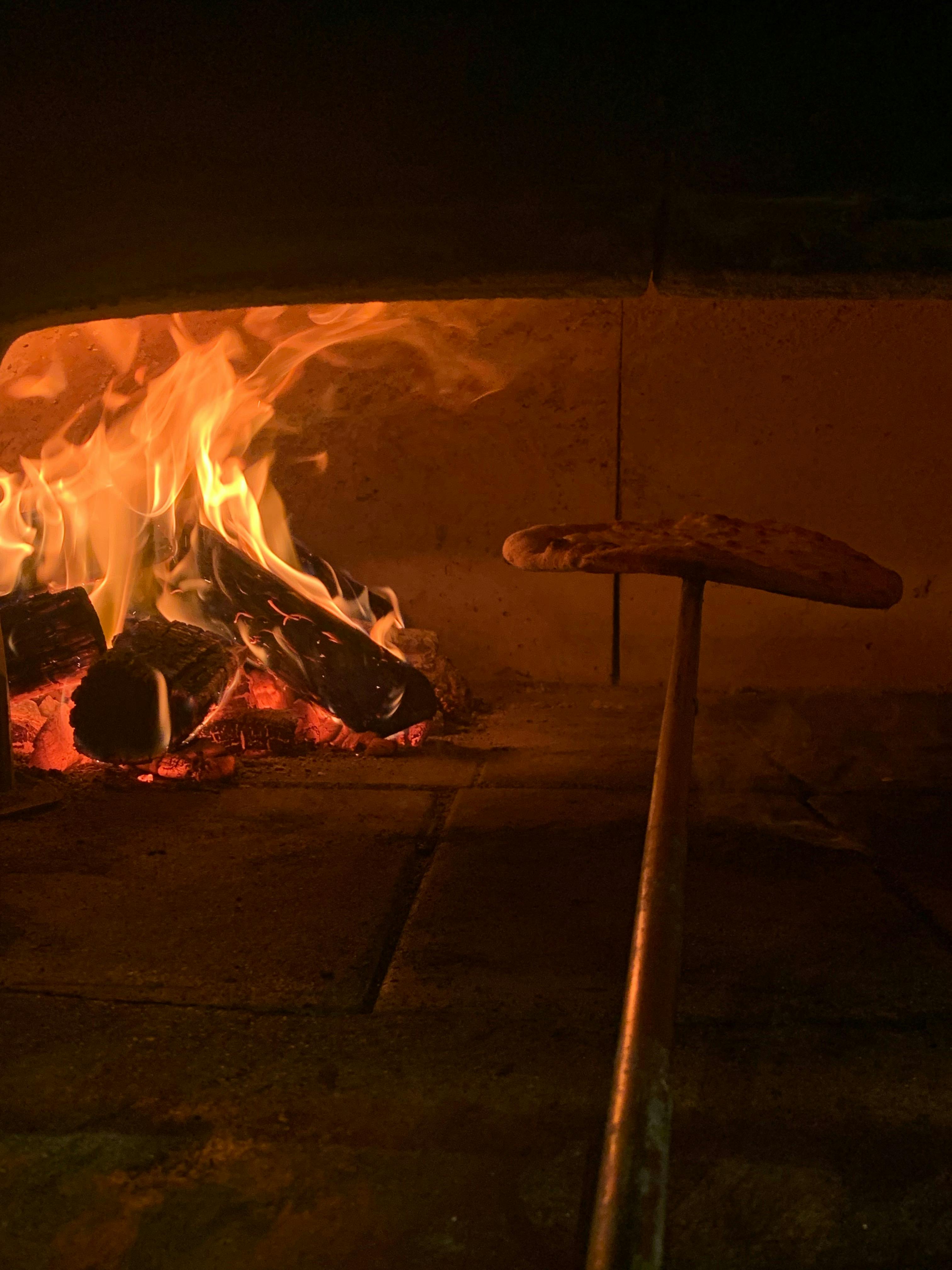 Our award winning chef Bart preparing one of his specialty woodfired pizzas