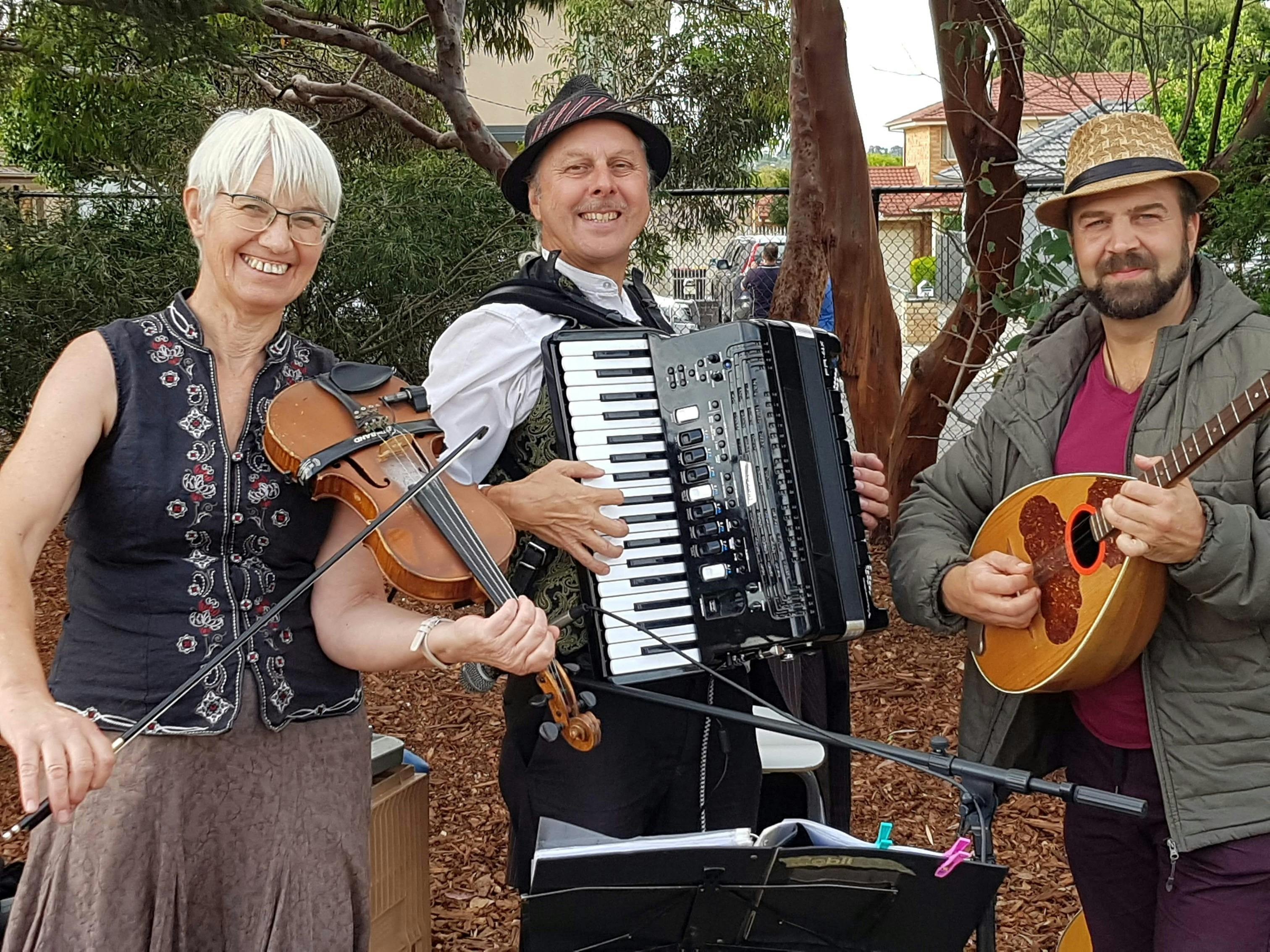 Three musicians from the Beat Around the Bush Dance Band