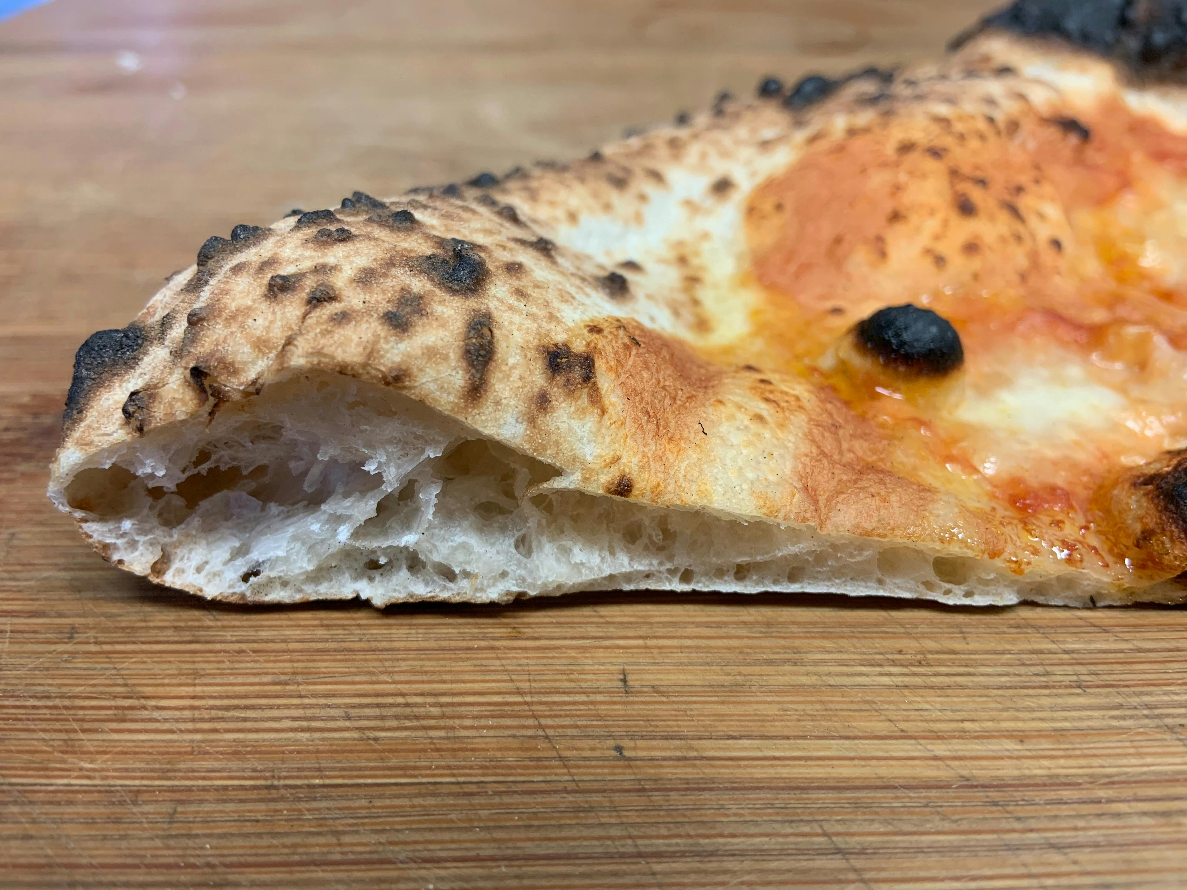 Neapolitan pizza crust heaven! Our dough is matured for a minimum of 72 hours before it is used.