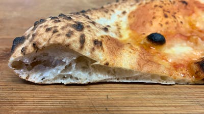 Neapolitan pizza crust heaven! Our dough is matured for a minimum of 72 hours before it is used.