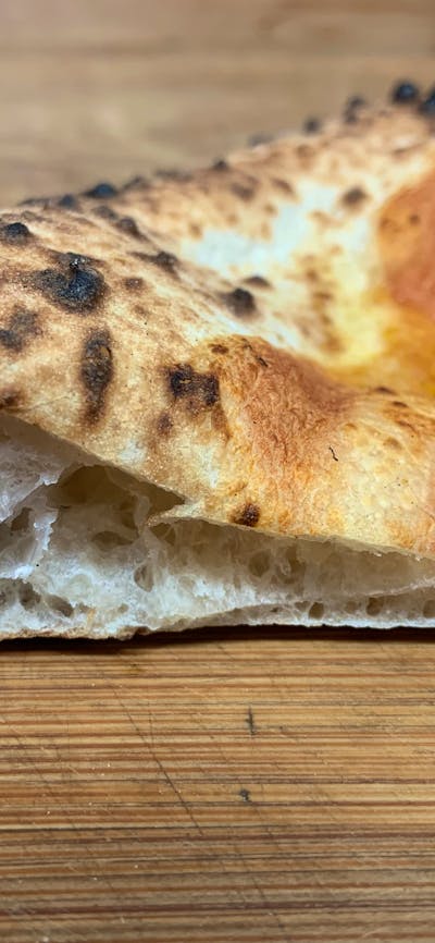 Neapolitan pizza crust heaven! Our dough is matured for a minimum of 72 hours before it is used.