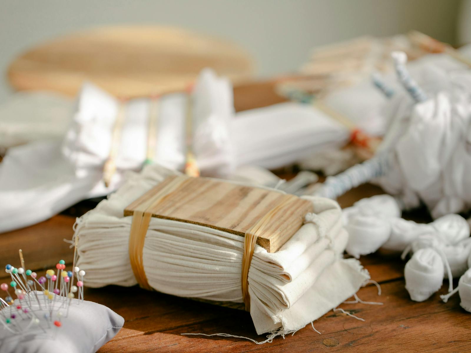 Piece of cloth secured with bindings, showing shibori preparation technique