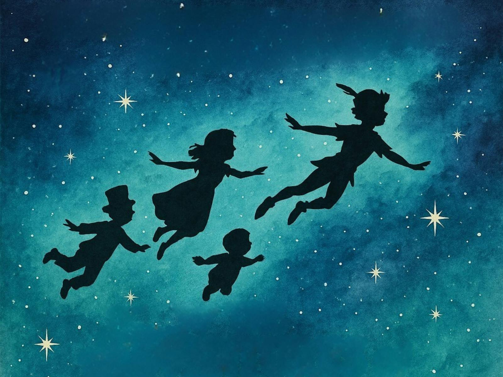 silhouettes of four children flying through the night sky