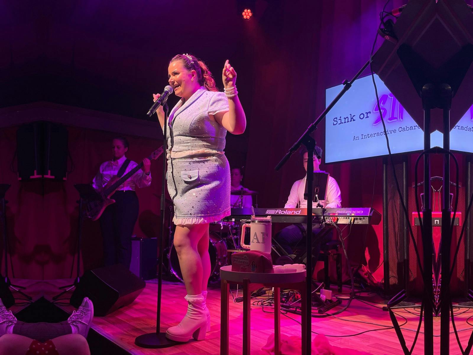 A singer standing on stage