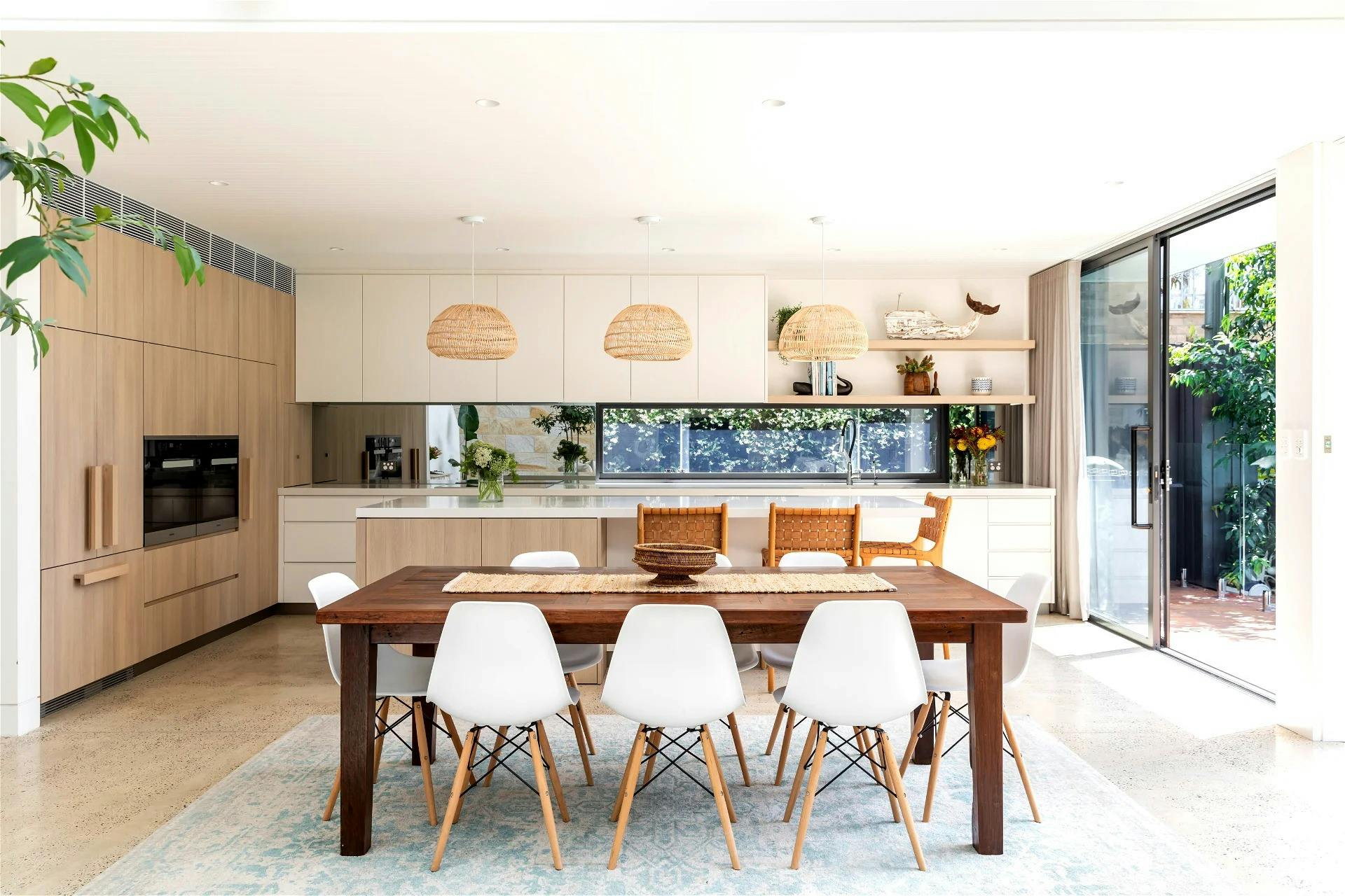 fully-equipped kitchen comes with an oversized kitchen bench completed with inviting bar seating and