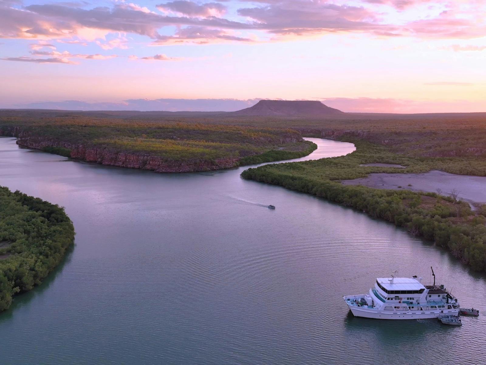 Anchor overnight in quiet rivers and explore surrounding creeks in the Expedition tenders