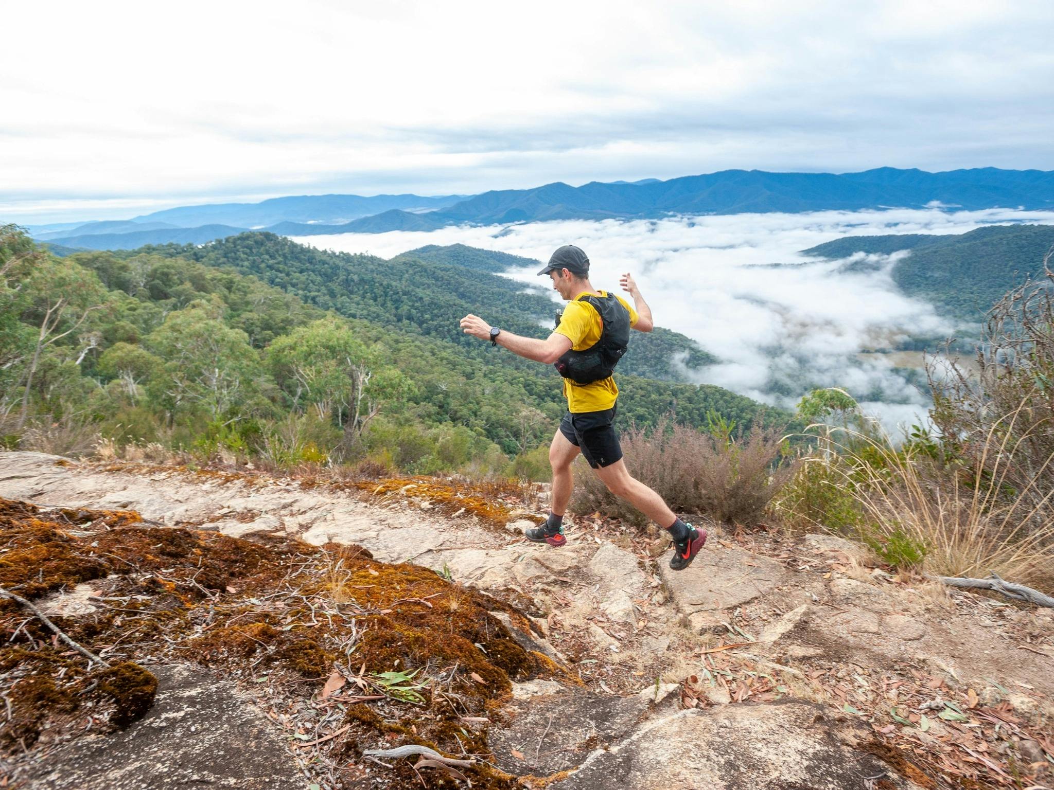 Man running along track.