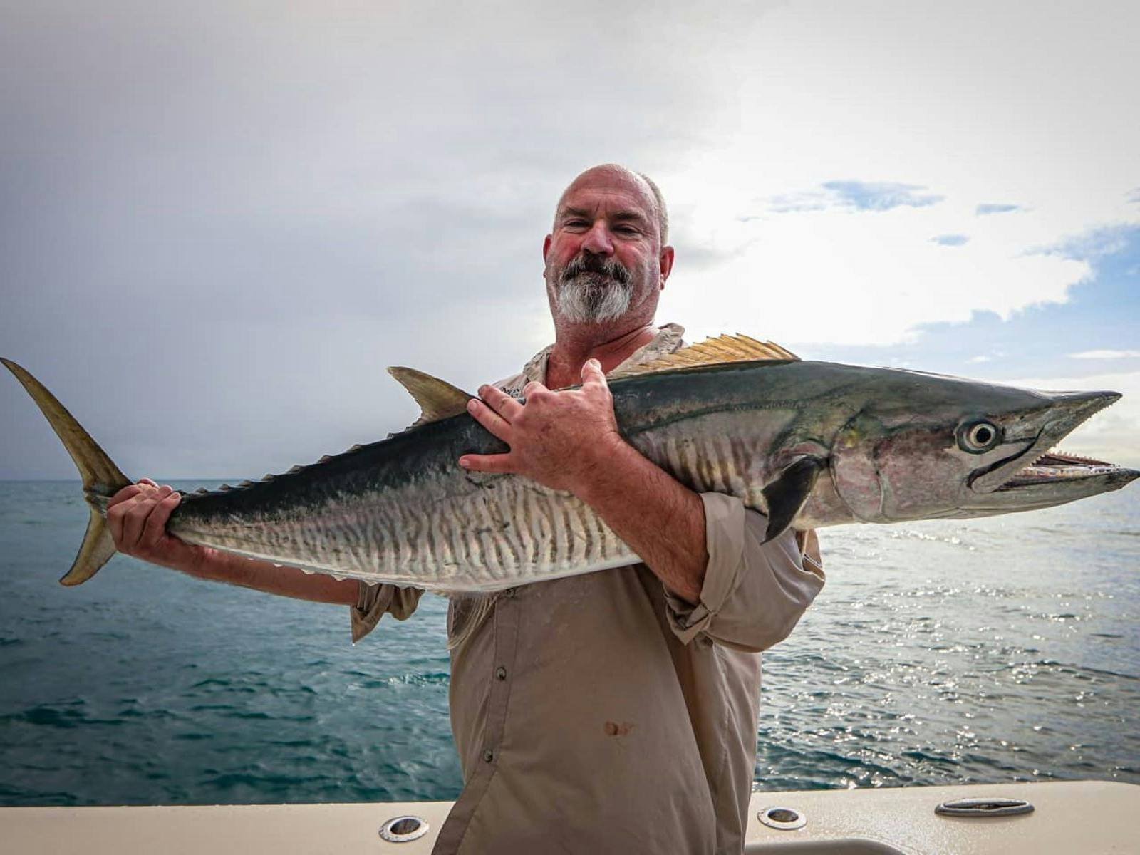 guest holding fish guest holding fish