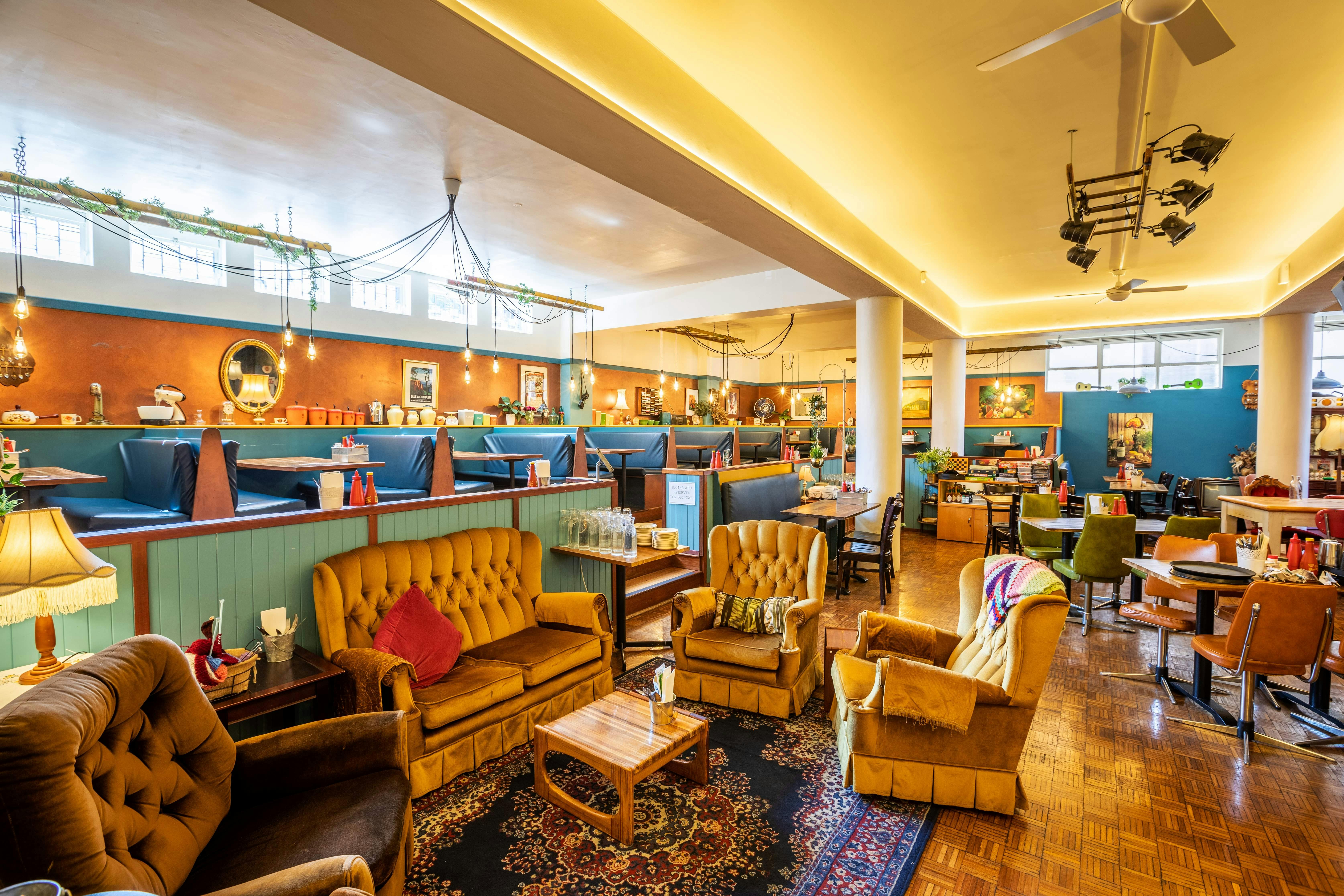 Retro diner style booths  and vintage couches for drinking cocktails and relaxing to live music