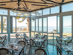 Sarin's Alfresco Dining offering beautiful views of Boston Bay. Book a table now!
