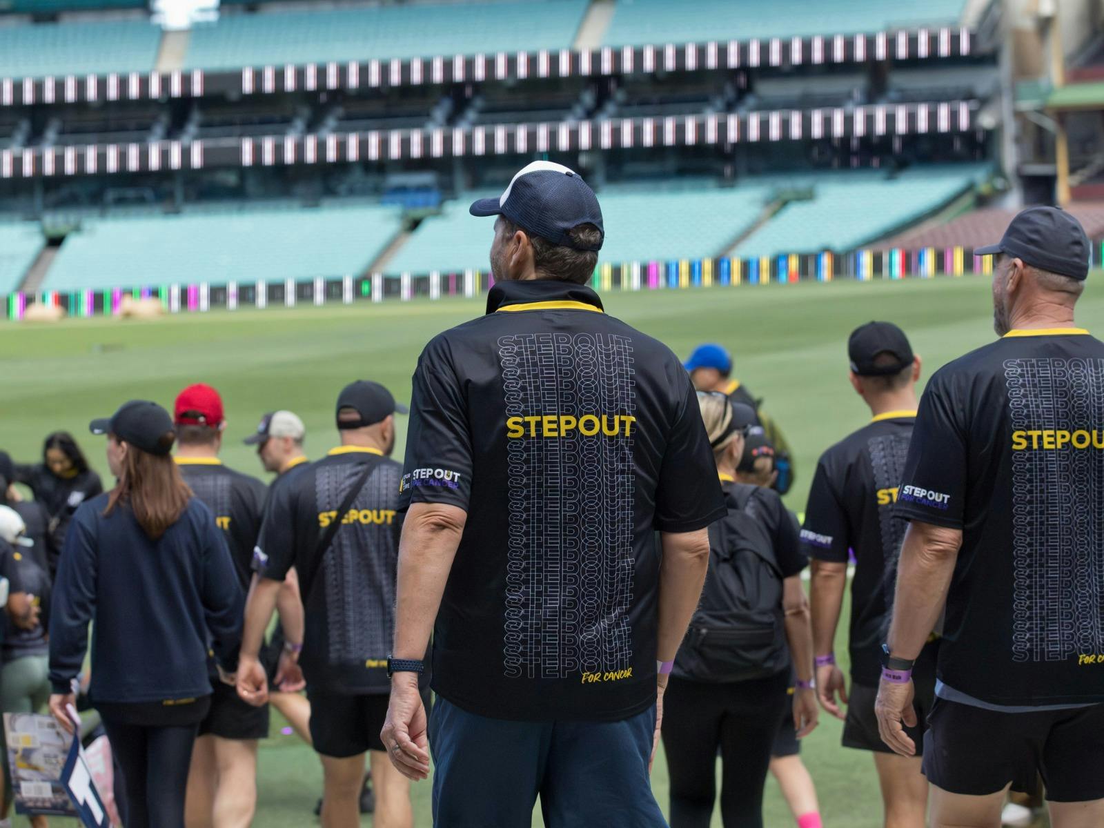 People walking through Sydney Cricket Ground at Step Out for Cancer