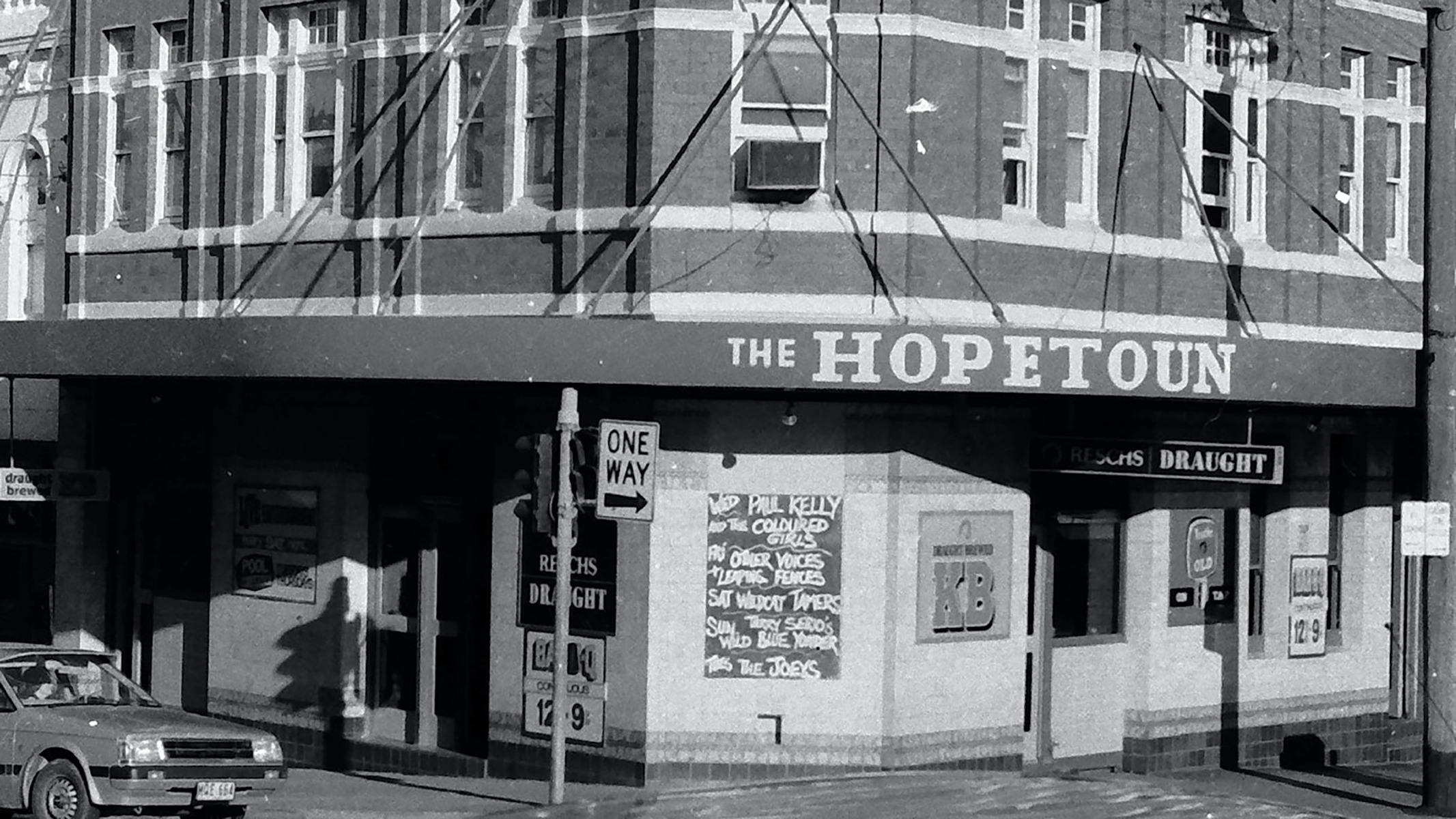 A black and white photo of the front of a pub called The Hopetoun