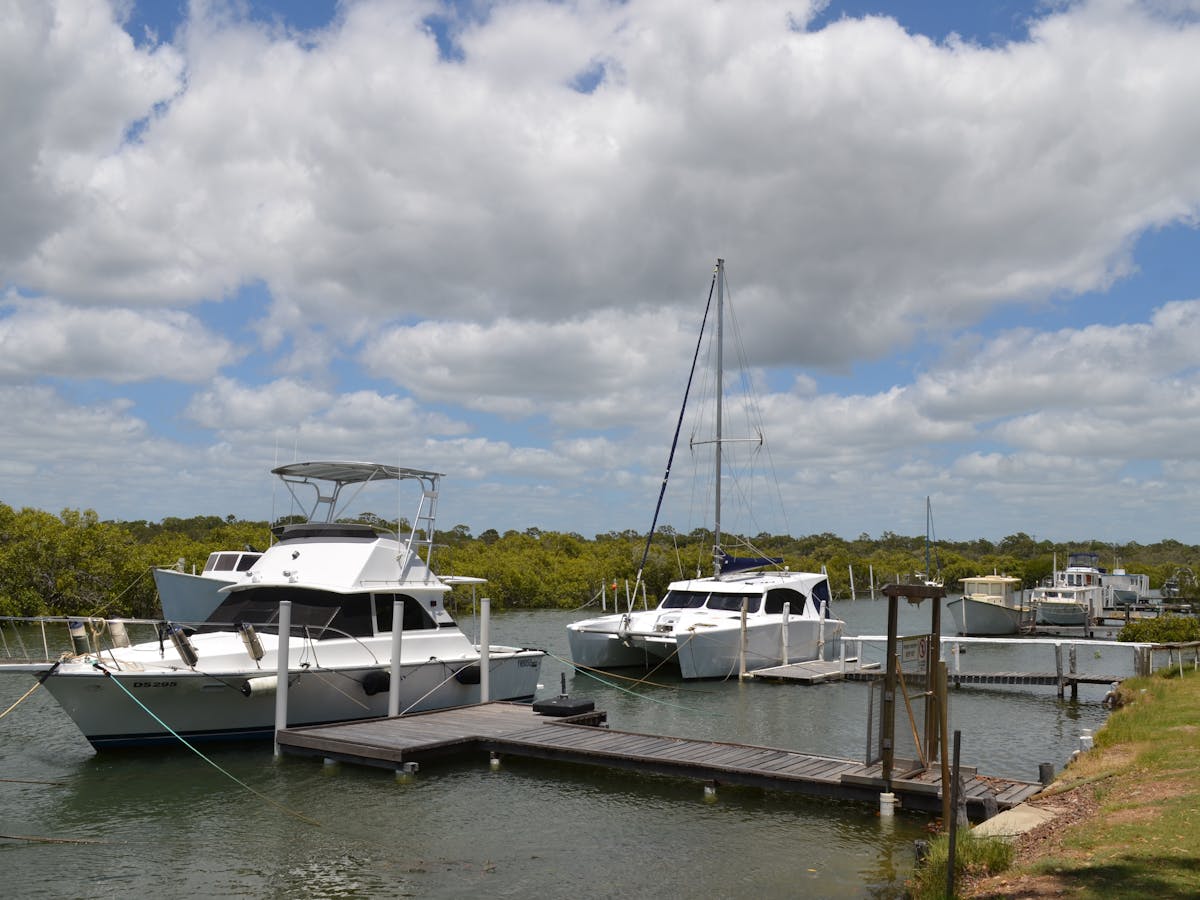 photo showing boats moored at small piers at Boonooroo on the Great Sandy Strait