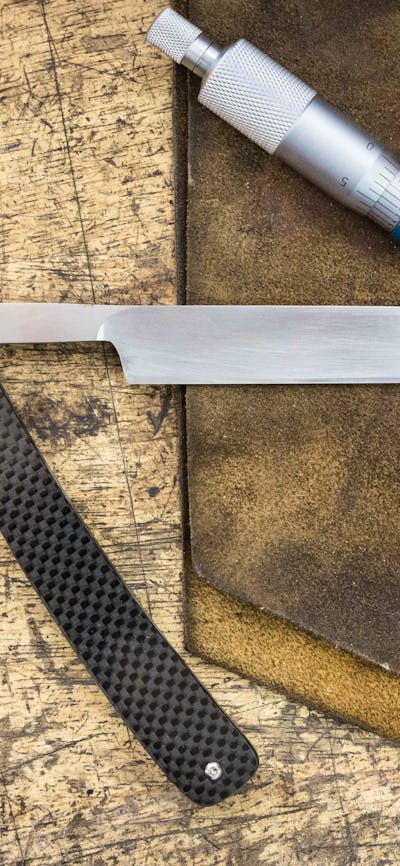 traditional straight razor on a workbench