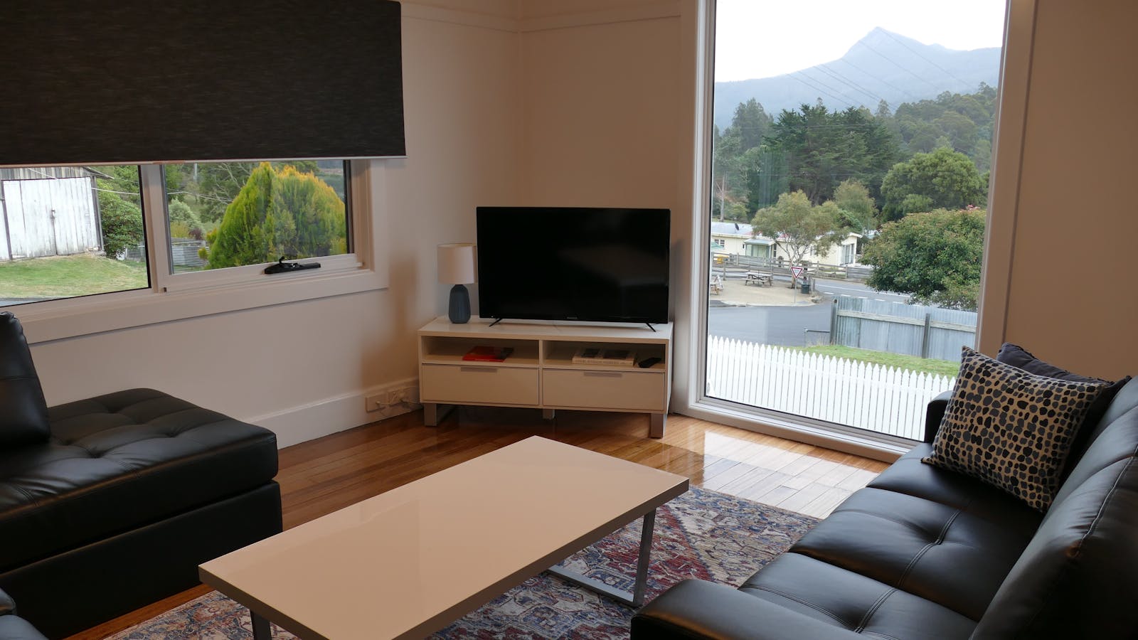 View of mountains in lounge room floor to ceiling picture window