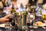 Table with wine bottle and glasses in the Rules Club function room