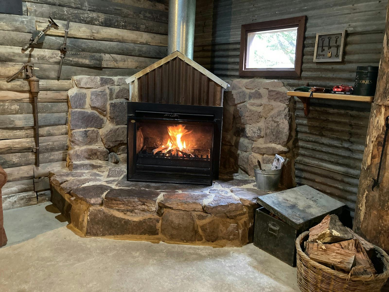 The Stables large, open fireplace with stone hearth