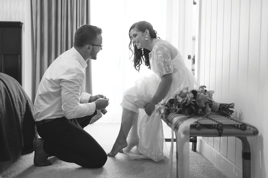 An eloping couple get ready together