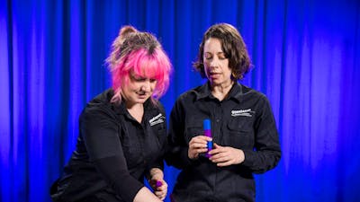 Two women explore patterns using coloured blocks