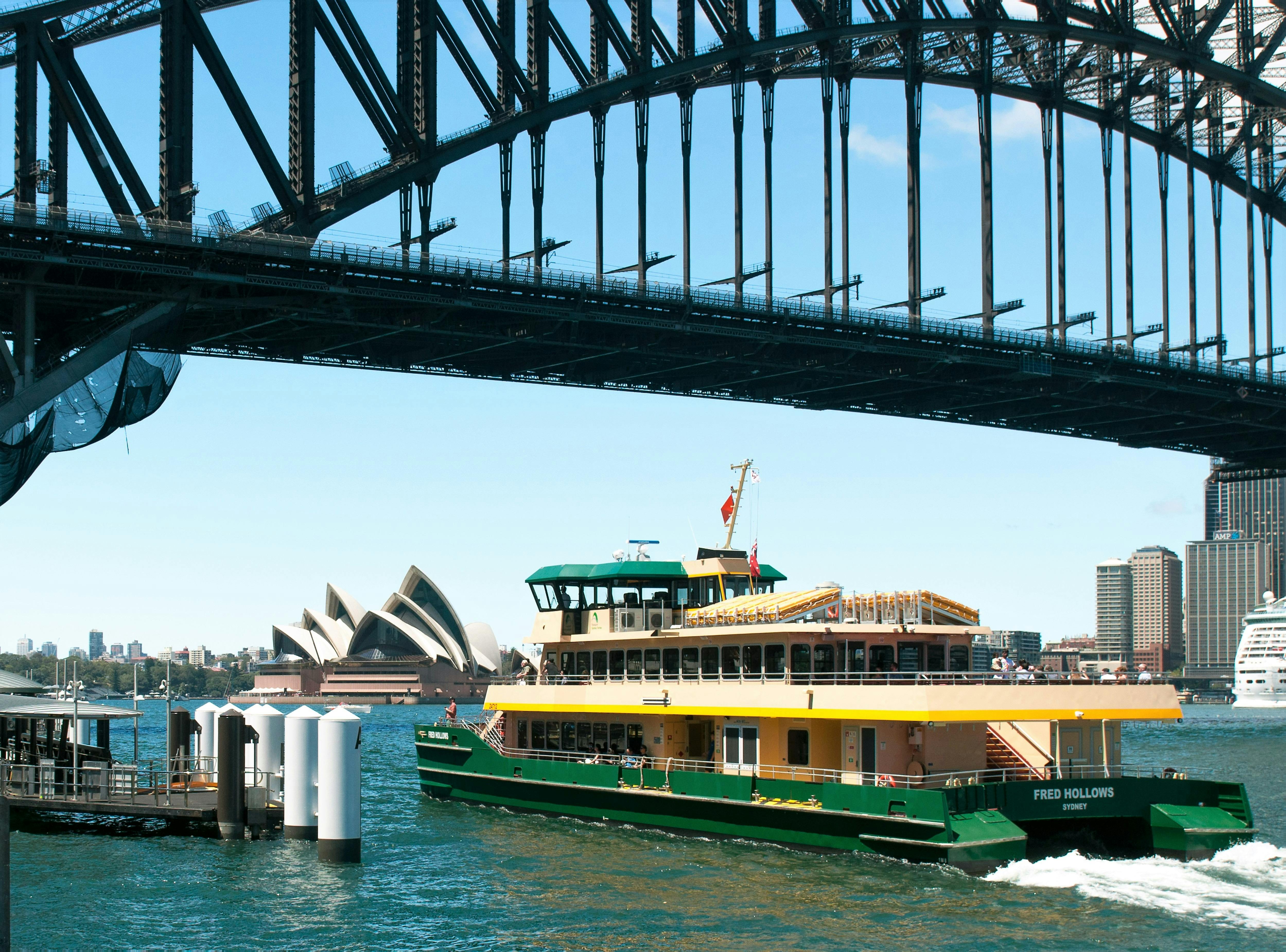 Ferry departs Milsons Point with Harbour Bridge above