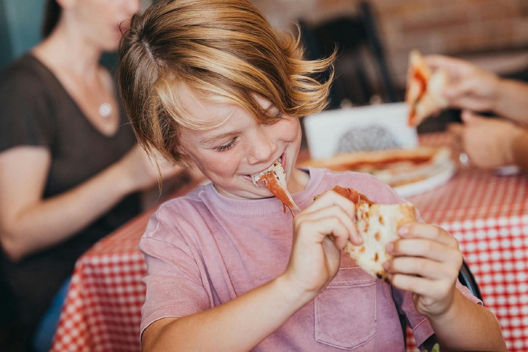 Enjoying pizza at Ometto Pizza Bar