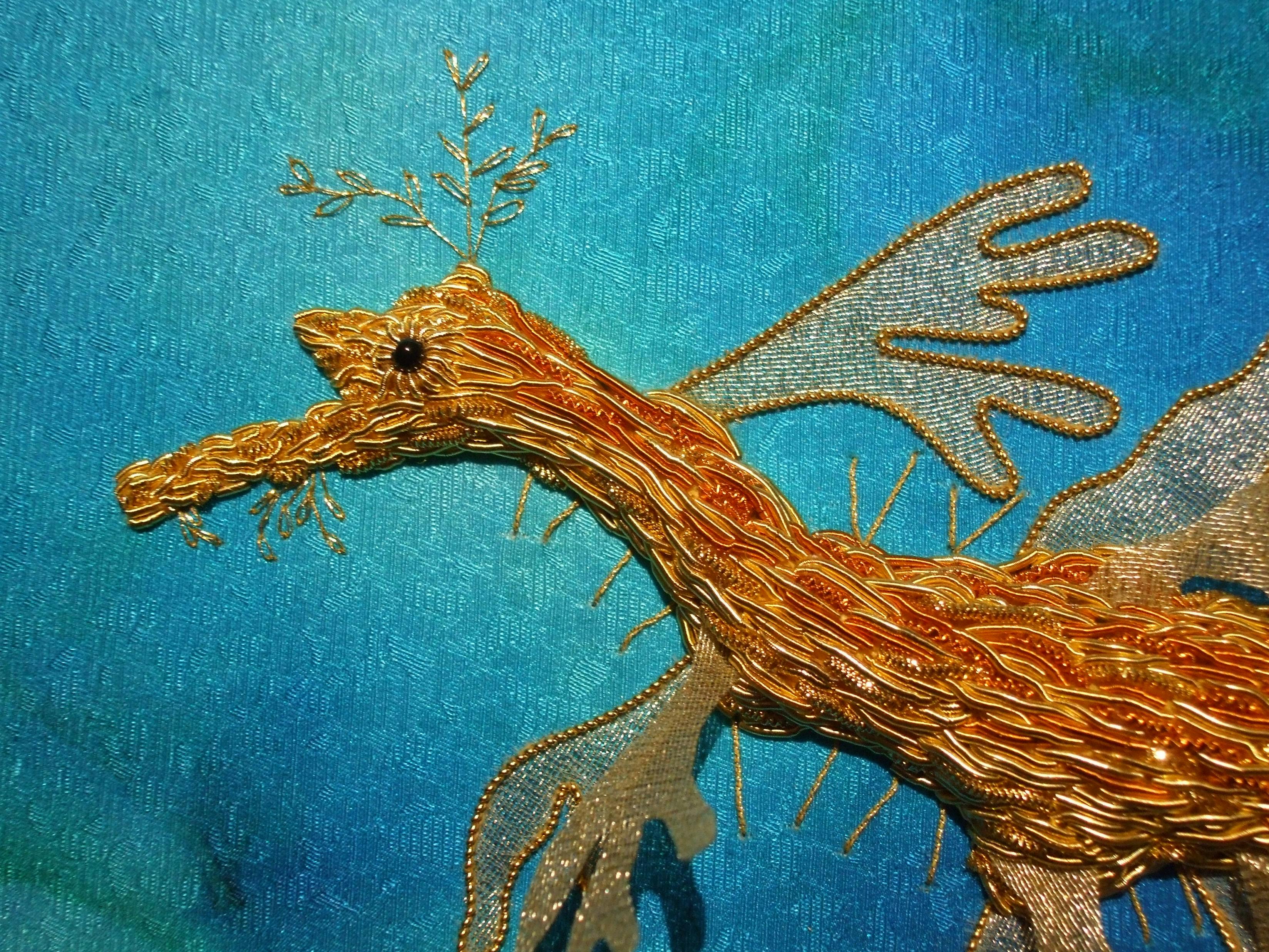 Goldwork embroidered seadragon close up