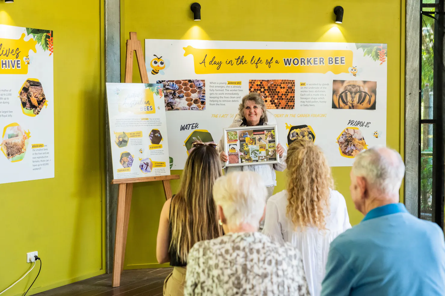 Beekeeper with guests doing our Live Bee Show