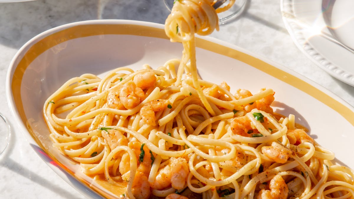 Fork twirling prawn pasta