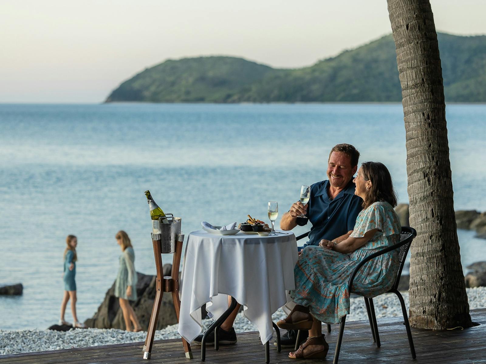 Couple enjoying afternoon canapés at Lovers Cove.