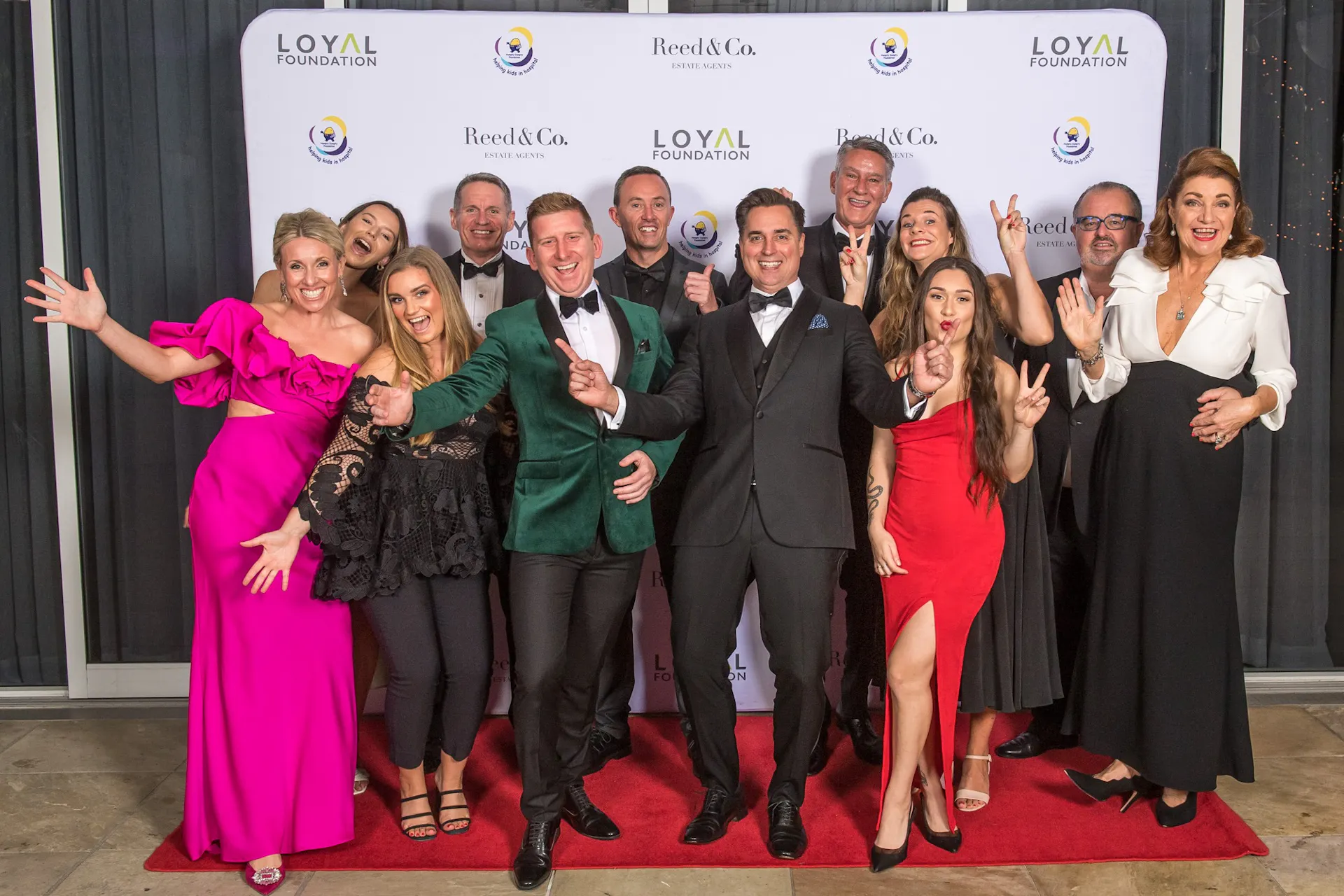 A group in formal dress at a Sunshine Coast corporate event