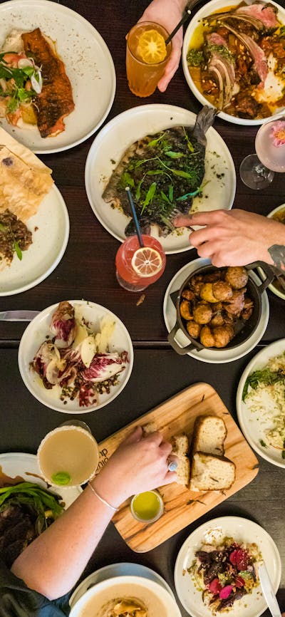 Food on table cooked by the Three Blue Ducks