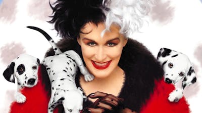 Woman with half black and half white hair with threedalmatian  puppies climbing over her