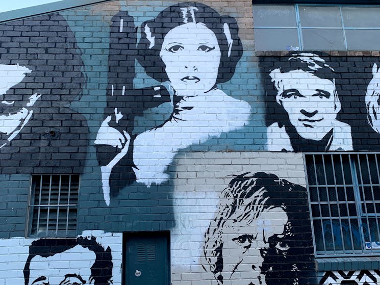 A graffiti of famous celebrities and characters