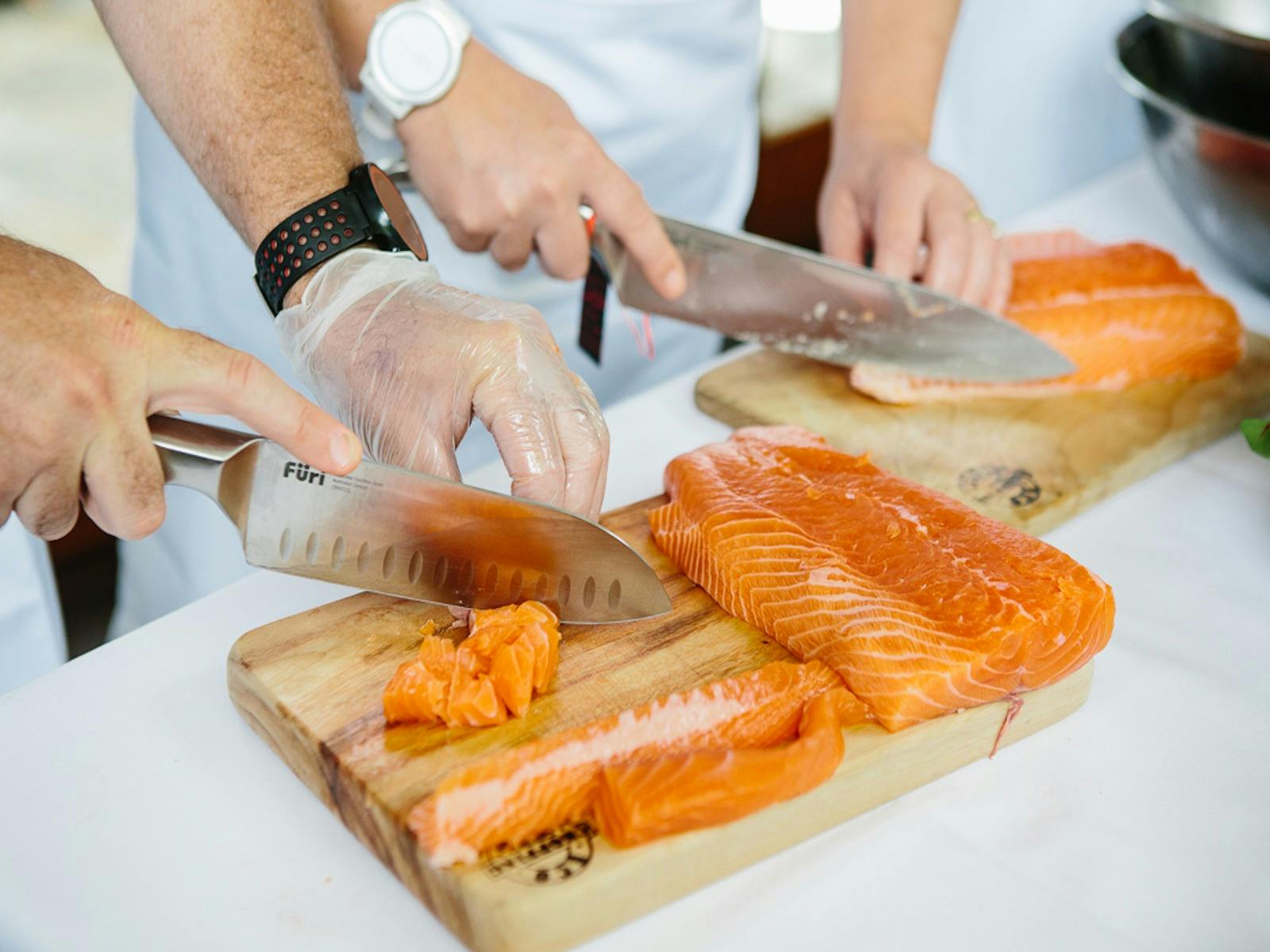 Chef Samantha Gowing leading a corporate cooking event at Tweed Cooking School