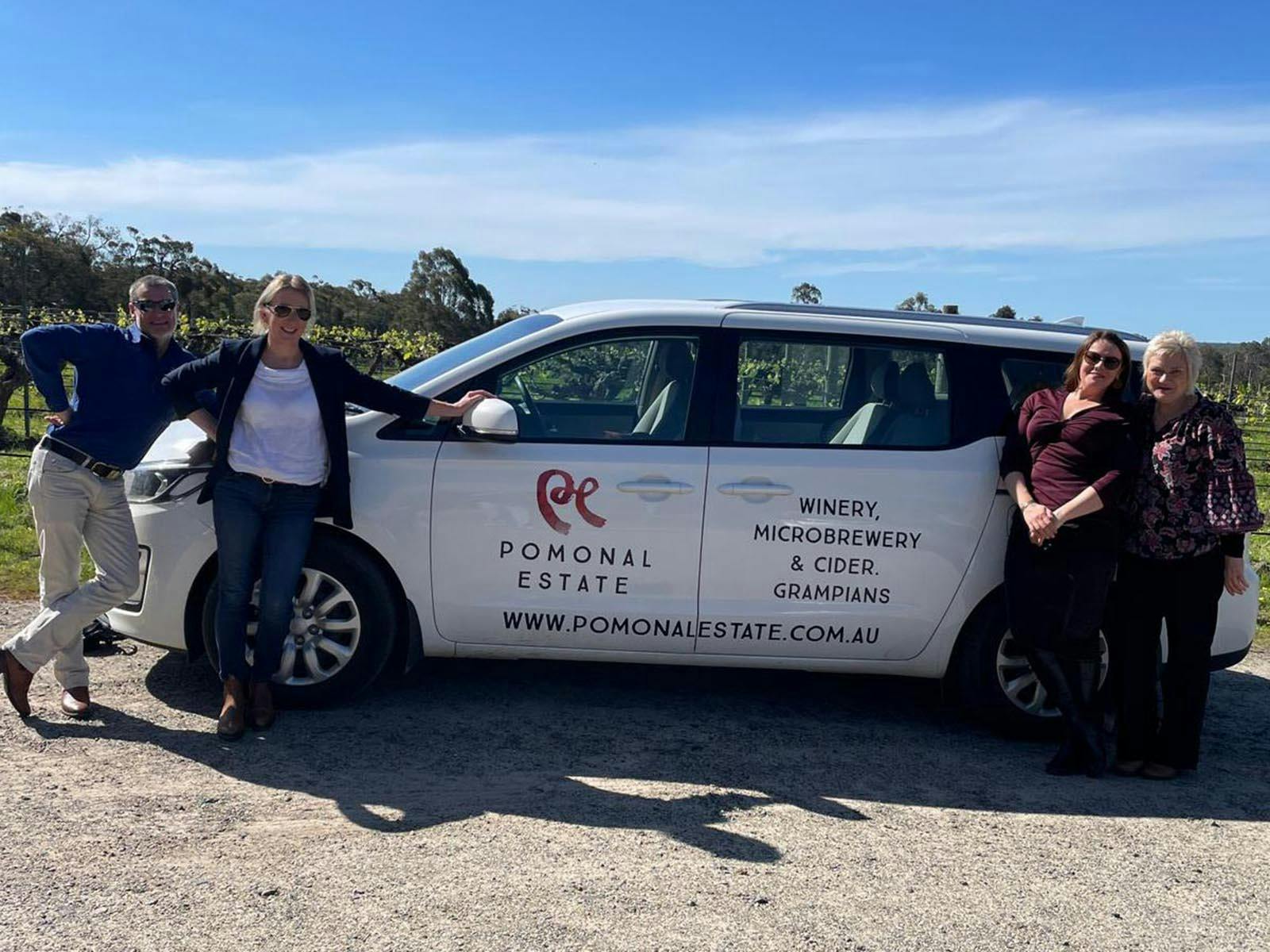 Guests posing with Pomonal Estate Car during the 2025 Progressive Lunch