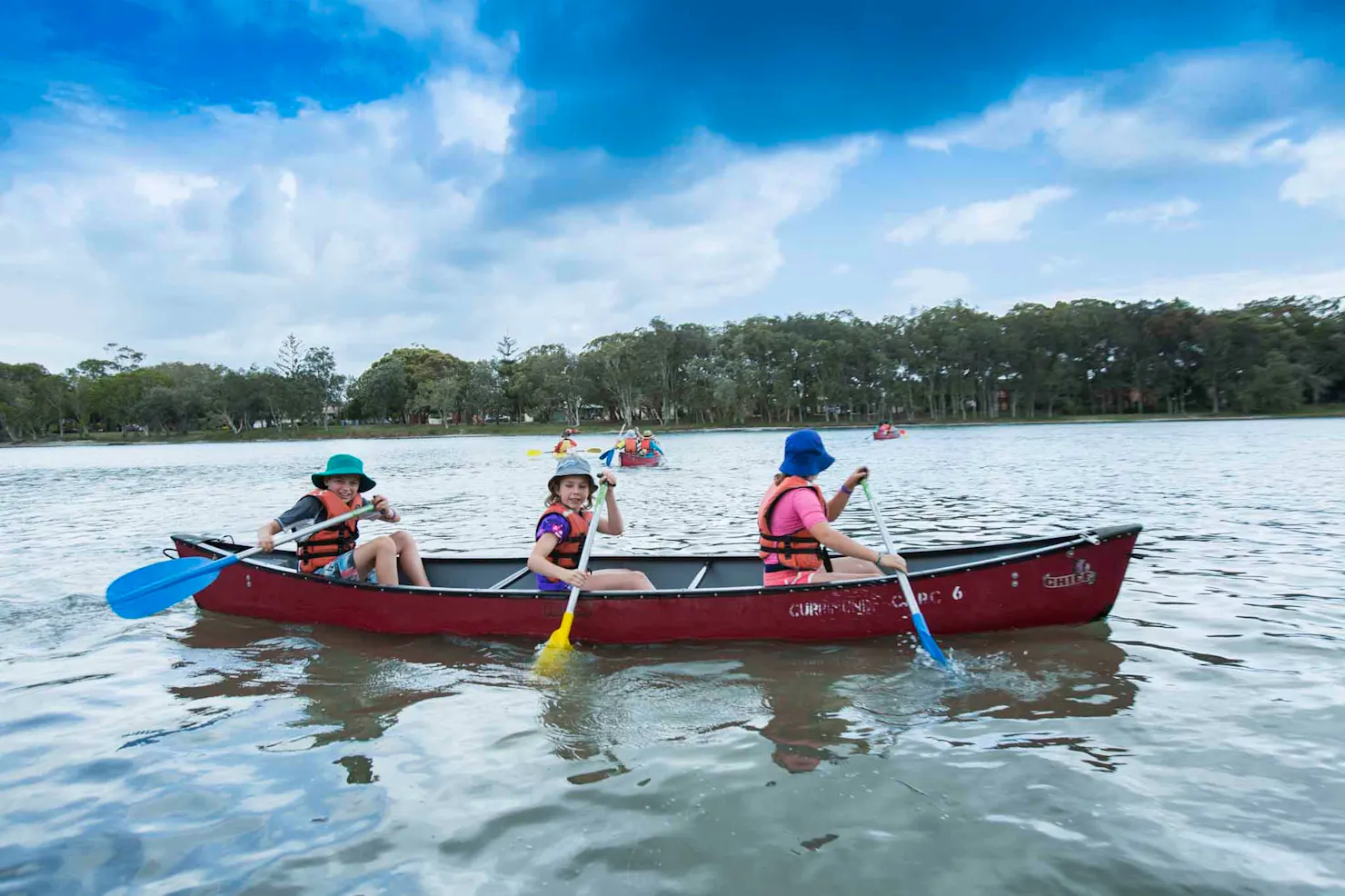 3 girls canoeing