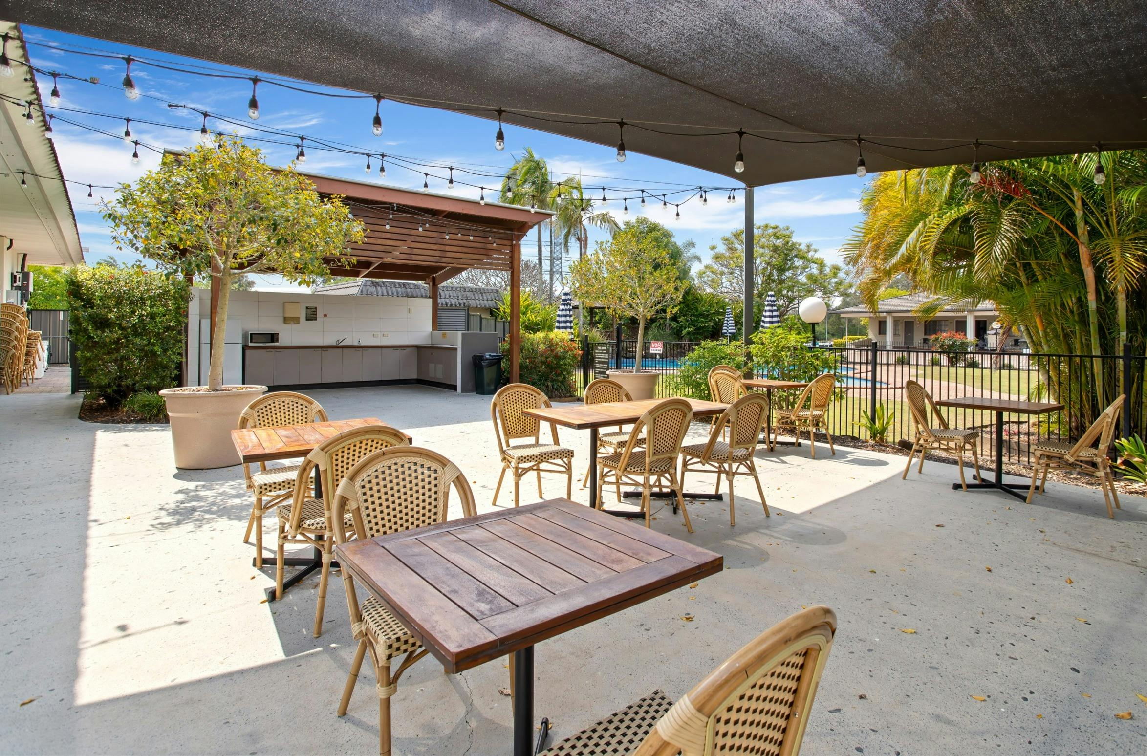 Outdoor kitchen bbq and shaded dining area